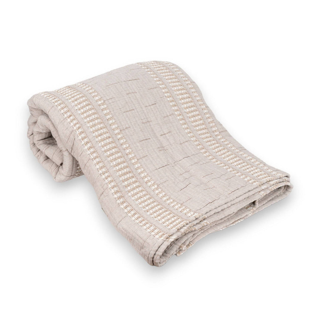 Folded TerraCotton Blanket in taupe color