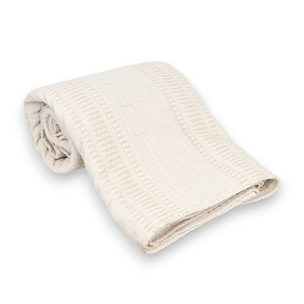 Folded TerraCotton Blanket in cream color