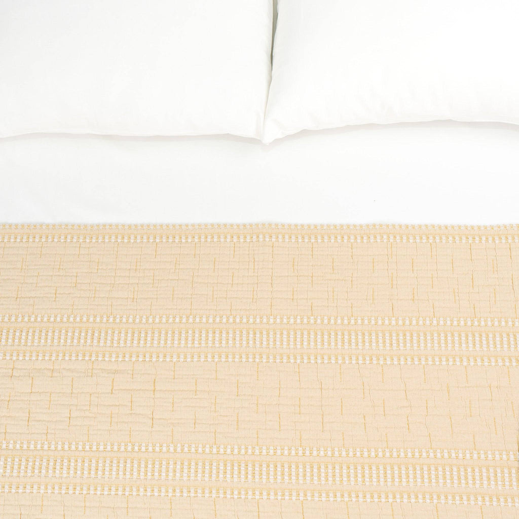 Beige TerraCotton Blanket on bed